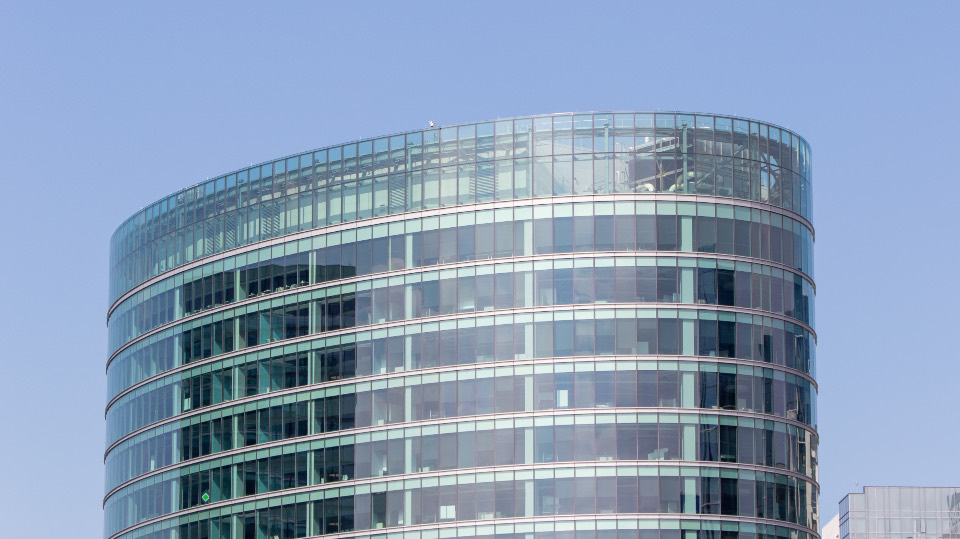 Curved glass exterior of a commercial office building